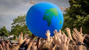 crowd-hands-raised-around-globe